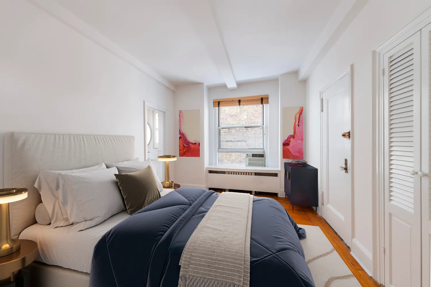 a bedroom with a bed and window