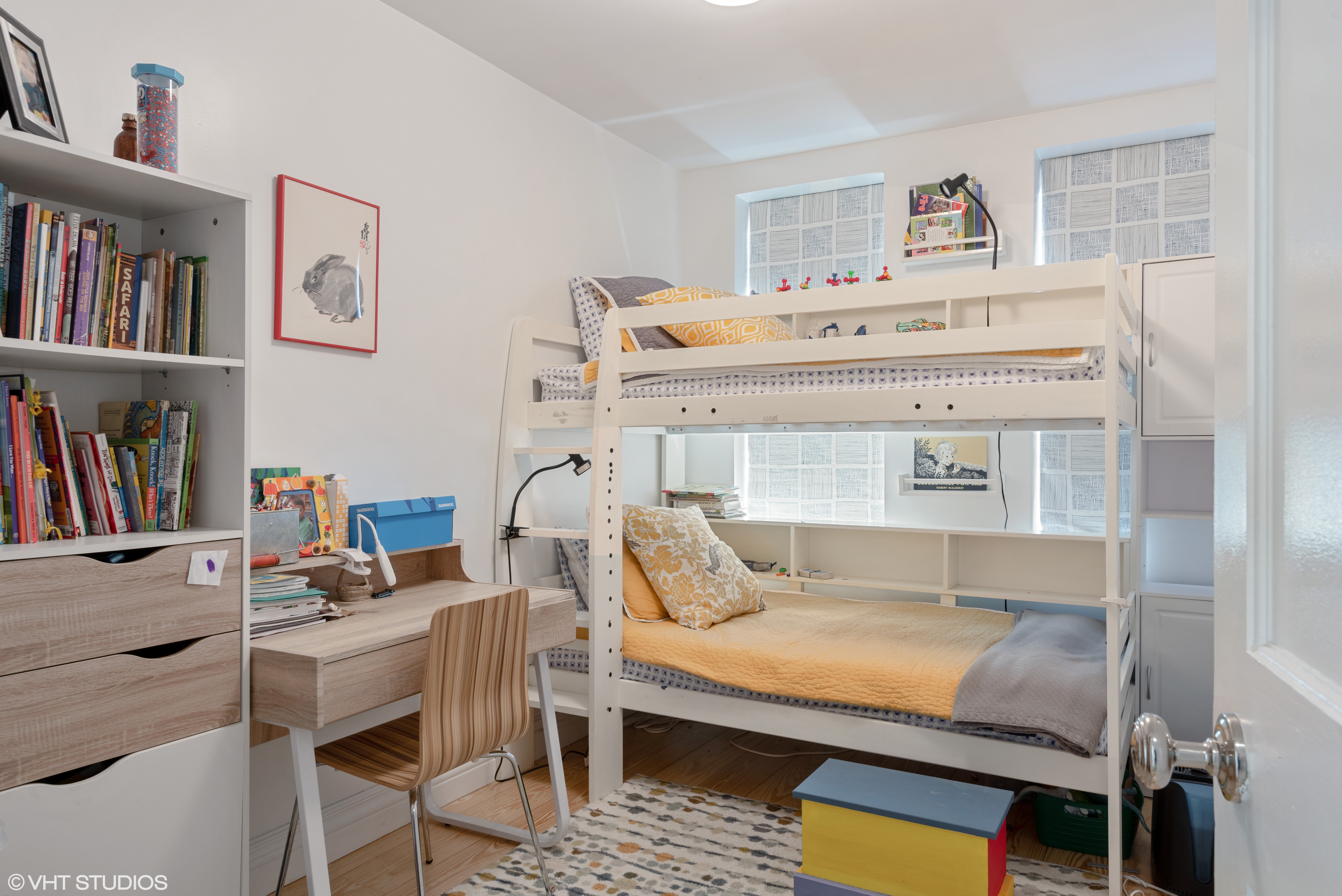 353 West 120th Street, Unit 1 Manhattan, NY 10027 - Photo 6 of 8 a living room with furniture and a book shelf