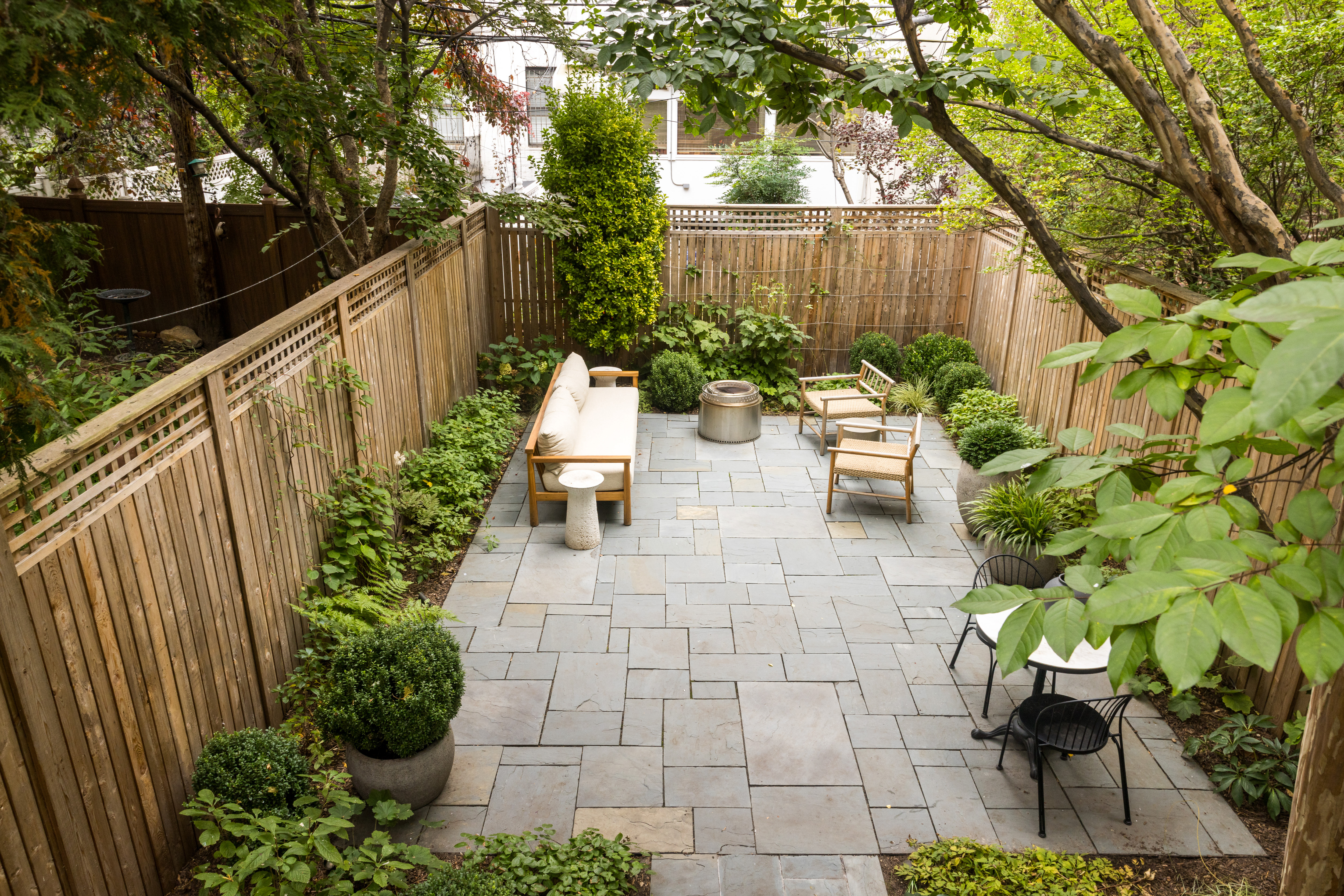 309 Pacific Street Brooklyn, NY 11201 - Photo 17 of 22 a view of two chairs in patio with wooden fence