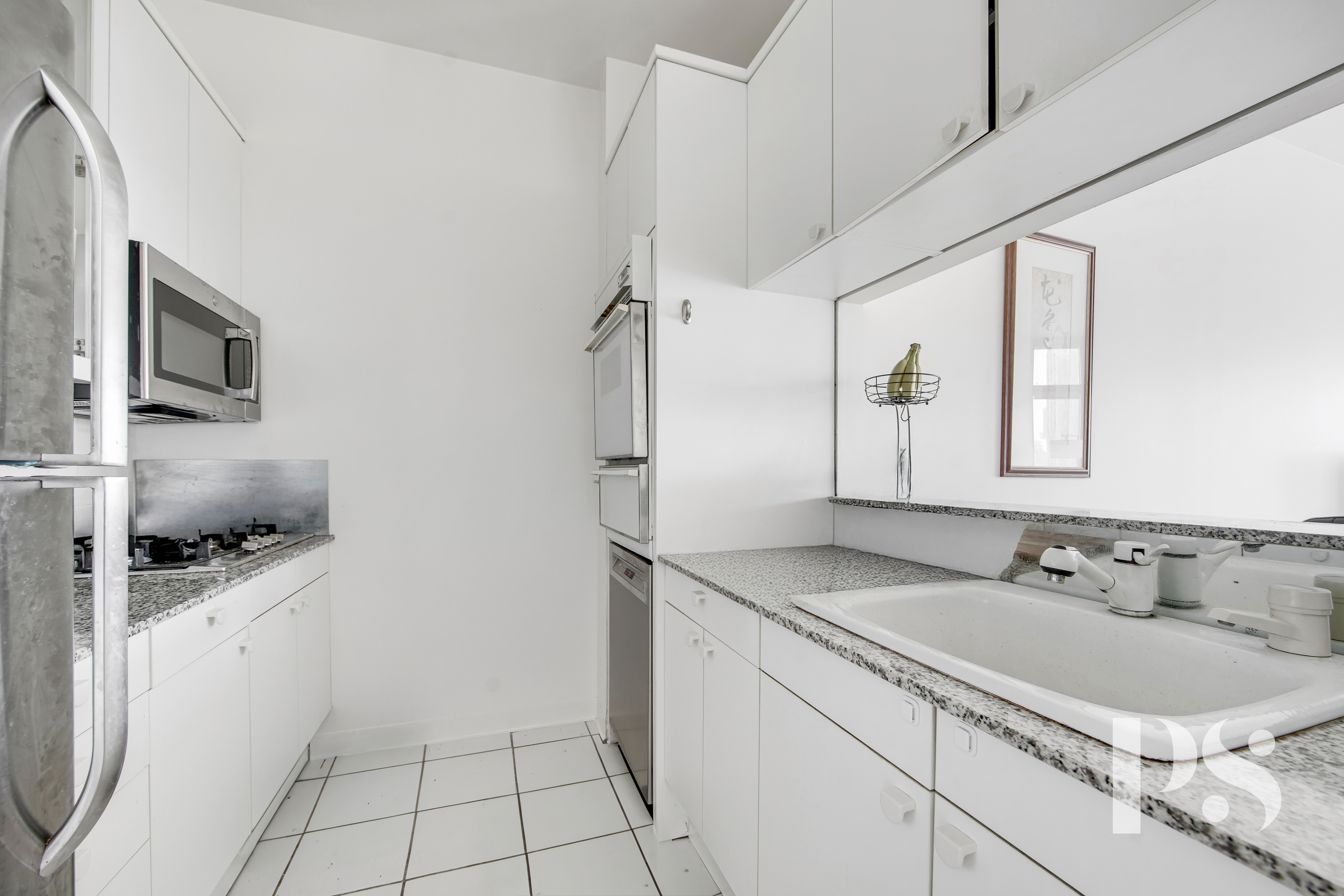 200 East 32nd Street, Unit 33C Manhattan, NY 10016 - Photo 6 of 12 a bathroom with a granite countertop sink a mirror and shower