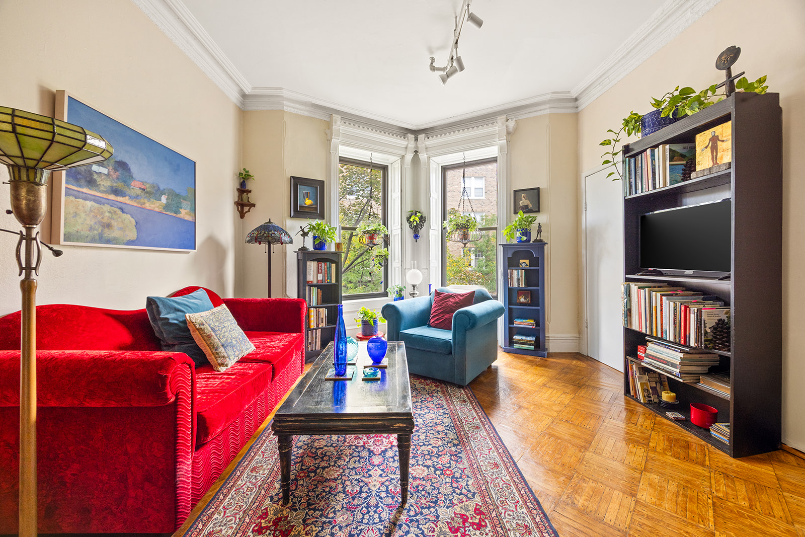 a living room with furniture and a flat screen tv