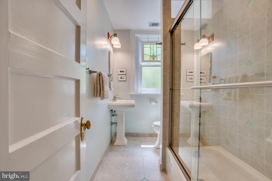 2415 20th Street Northwest, Unit 38 Washington, DC 20009 - Photo 18 of 30 a bathroom with a shower and a mirror