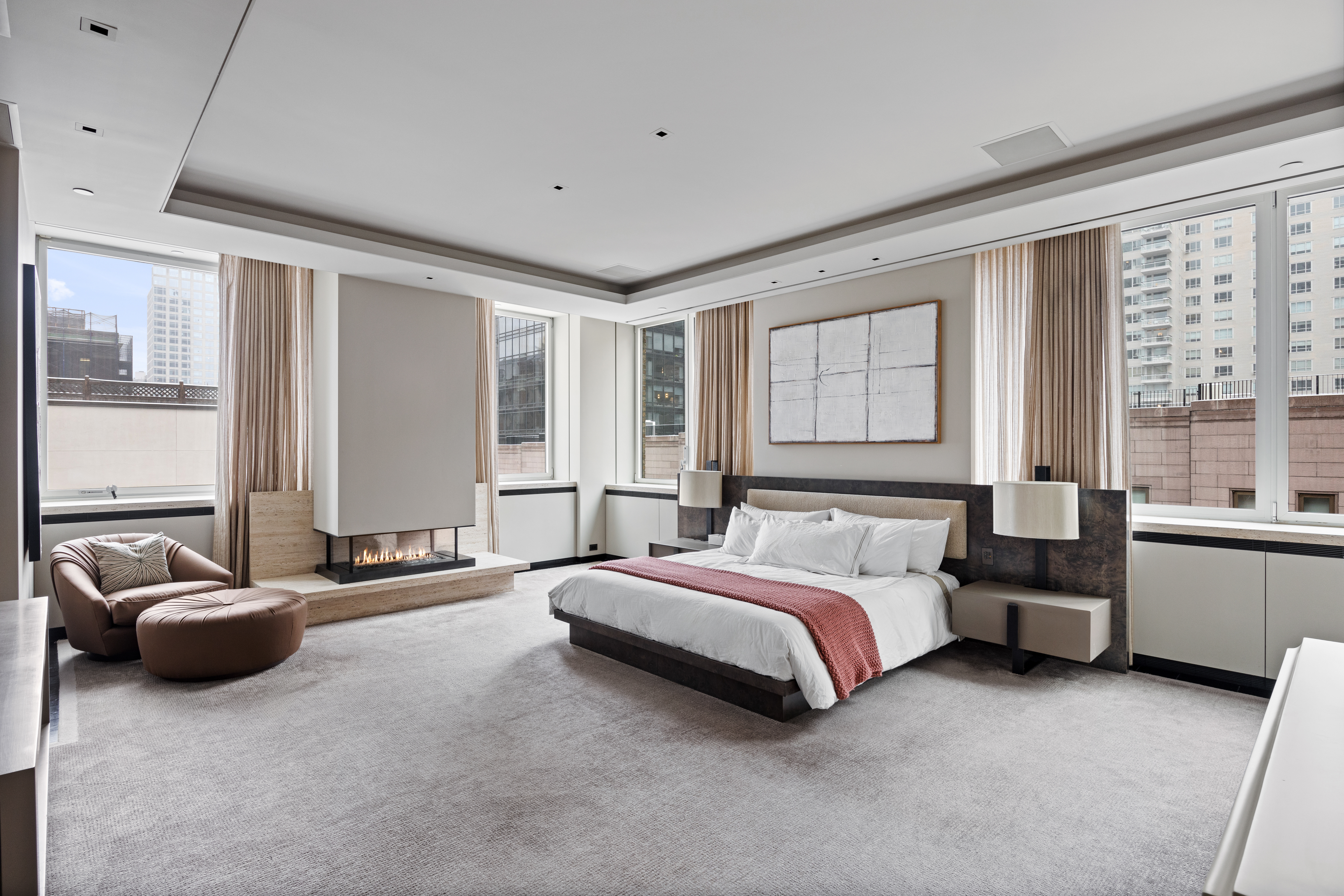 219 East 67th Street, Unit 5 Manhattan, NY 10065 - Photo 7 of 18 a spacious bedroom with a bed and a couch