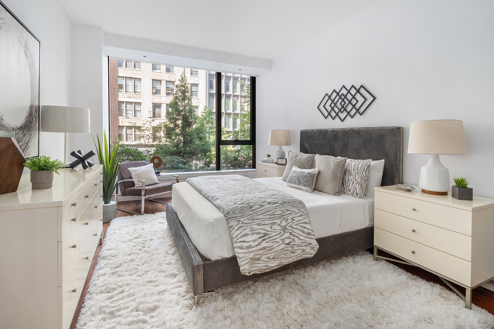 255 Hudson Street, Unit TH1 Manhattan, NY 10013 - Photo 6 of 8 a bed room with a bed and a lamp