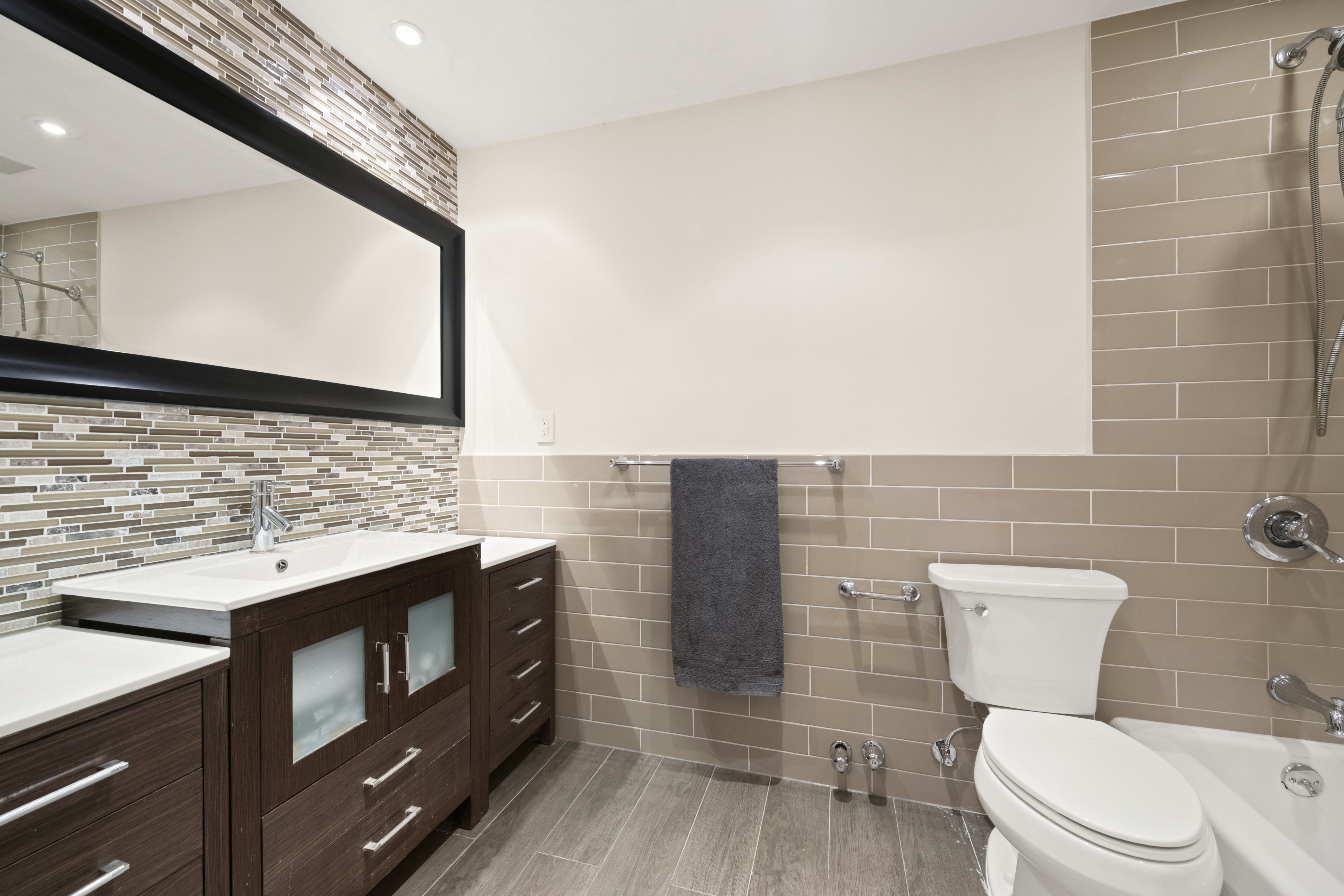 176 Broadway, Unit 9F Manhattan, NY 10038 - Photo 4 of 9 a bathroom with a sink a toilet and mirror