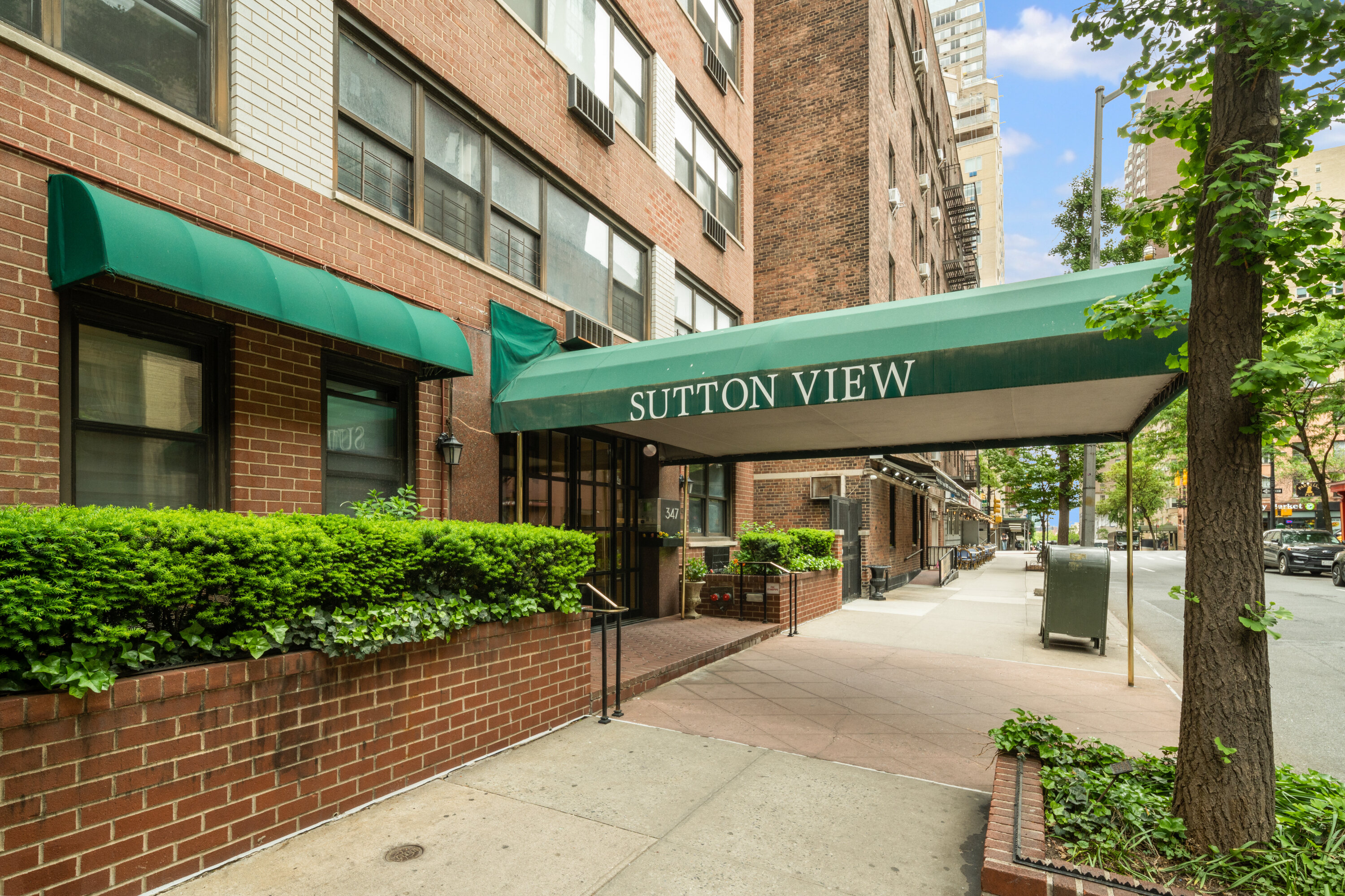 347 East 53rd Street, Unit 2C Manhattan, NY 10022 - Photo 15 of 18 a view of a building with a porch