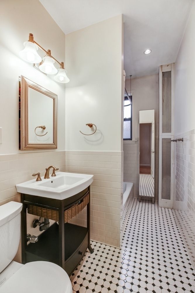 779 Riverside Drive, Unit B60 Manhattan, NY 10032 - Photo 4 of 9 a bathroom with a sink and a mirror