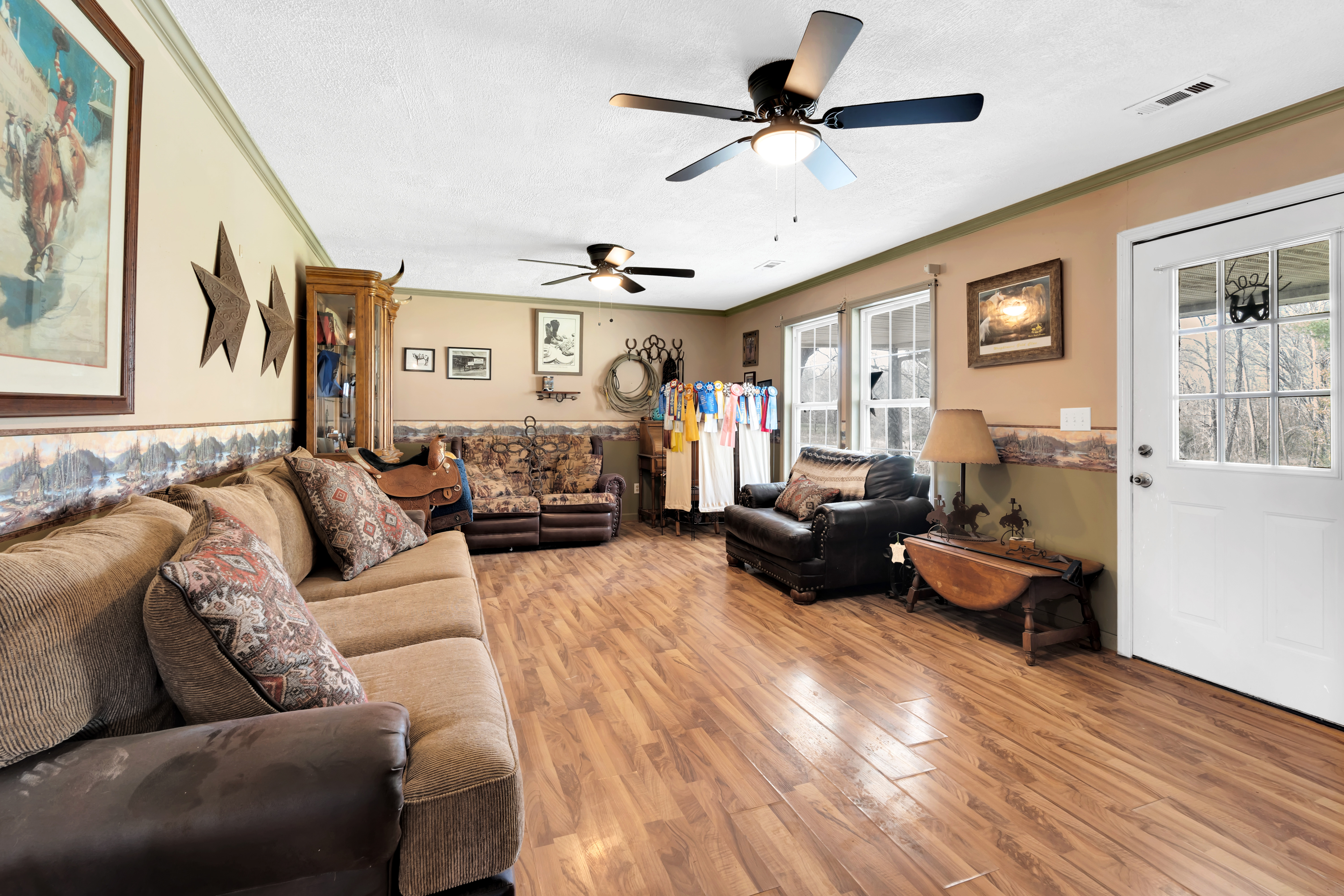 2073 Harpo Road Manchester, TN 37355 - Photo 28 of 45 a living room with furniture ceiling fan and a wooden floor