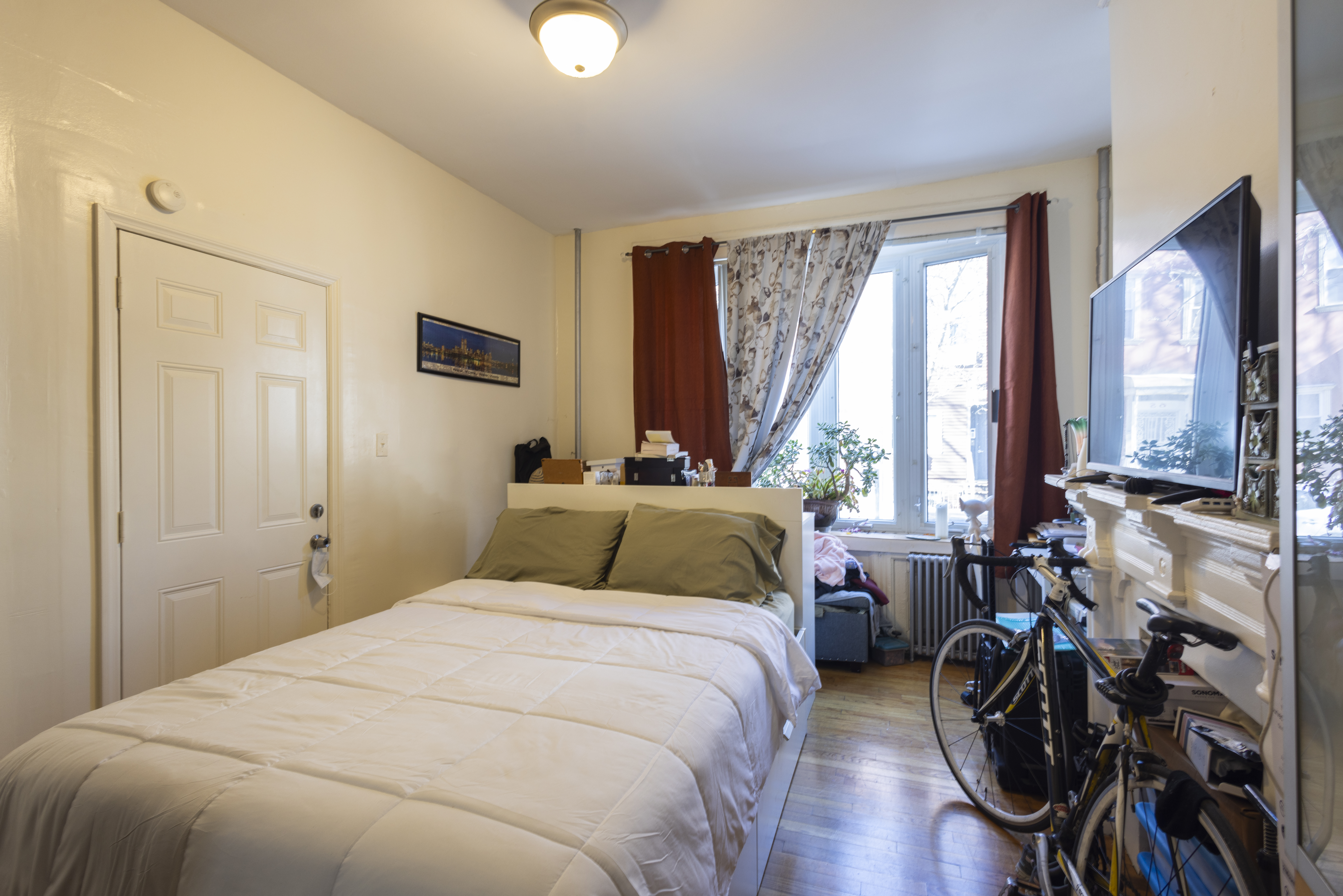 40 A Jewel Street Brooklyn, NY 11222 - Photo 4 of 18 a bedroom with a bed a large window and flat screen tv