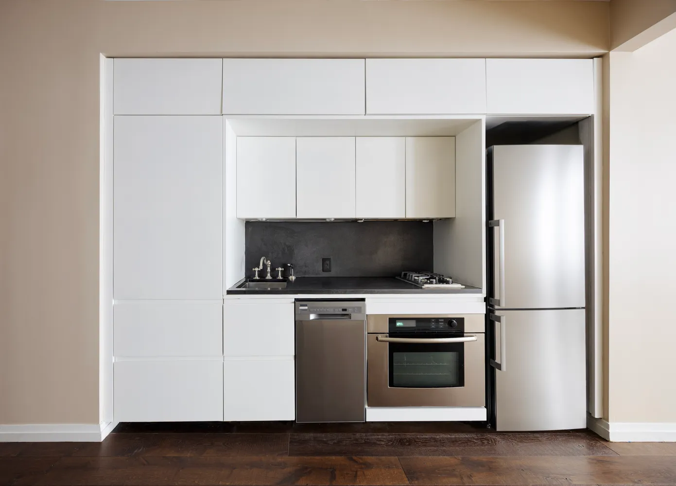 a kitchen with a stove and a refrigerator