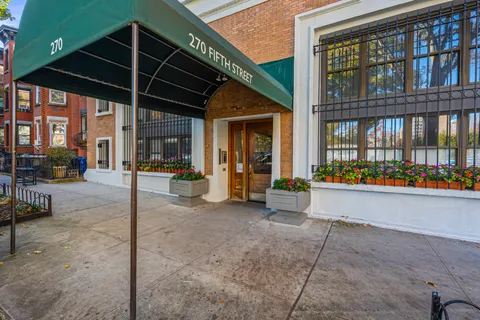 a view of a building with a garden