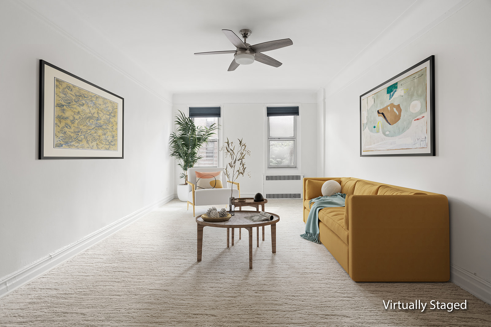 a living room with furniture and a painting on the wall