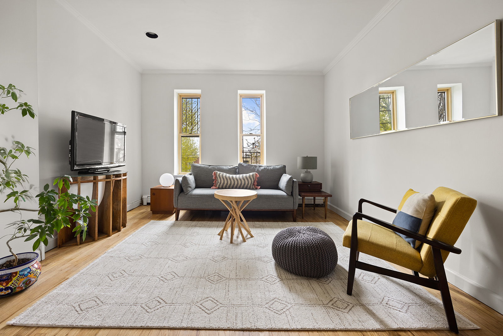491 12th Street, Unit 2 Brooklyn, NY 11215 - Photo 3 of 21 a living room with furniture and a flat screen tv