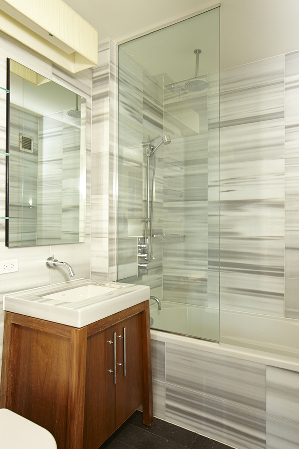 88 Greenwich Street, Unit 1023 Manhattan, NY 10006 - Photo 5 of 20 a bathroom with a sink and a mirror