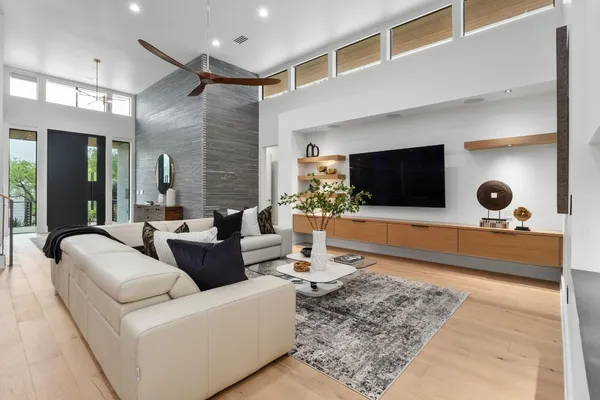 a living room with furniture and a flat screen tv