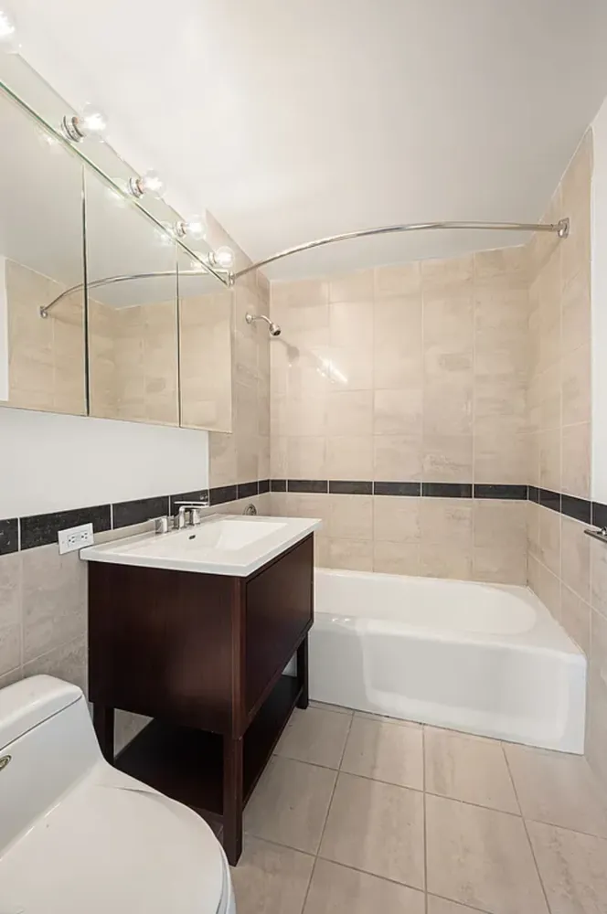 a bathroom with a sink a bath tub and shower