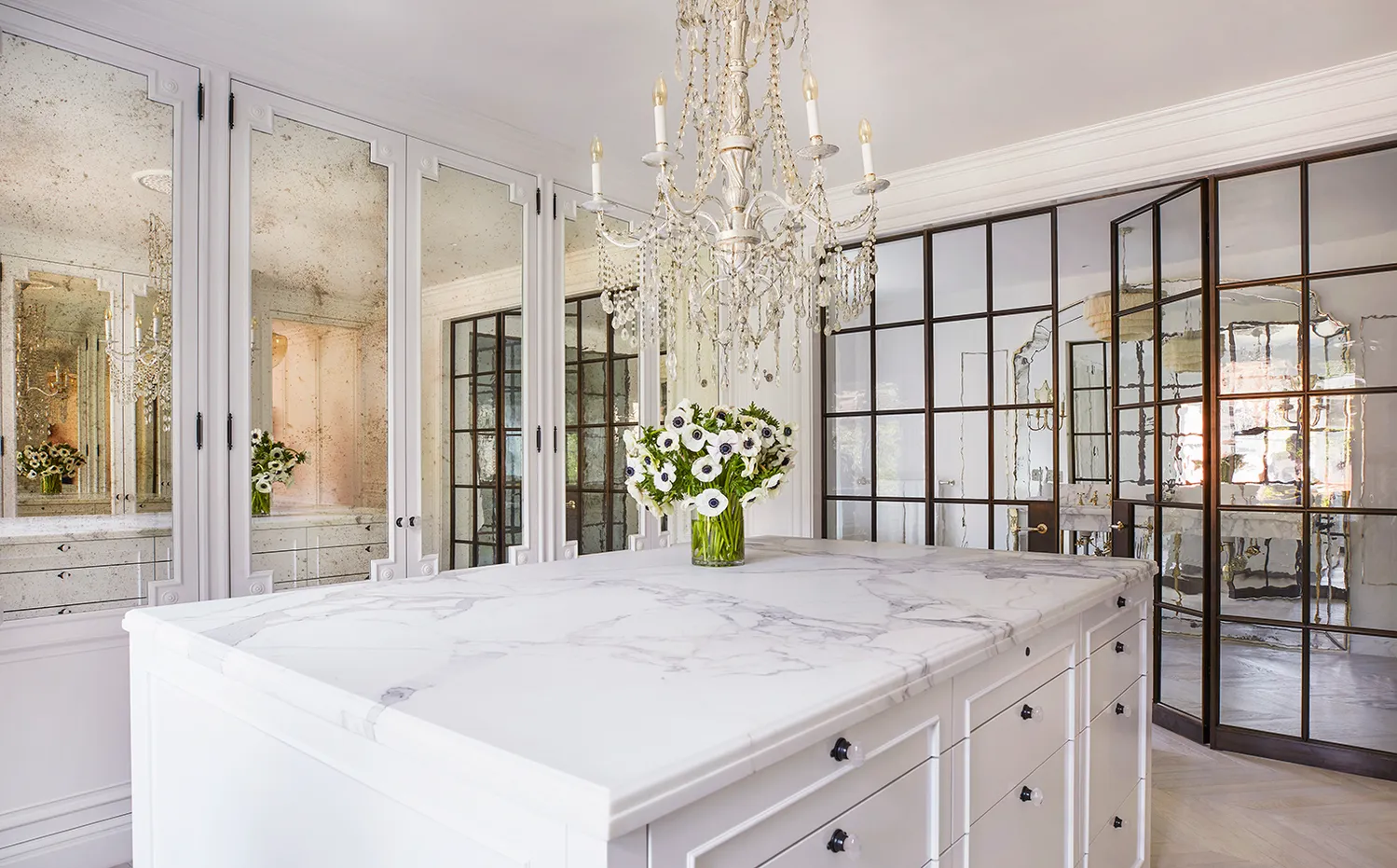 a bathroom with a granite countertop sink a large mirror and a shower