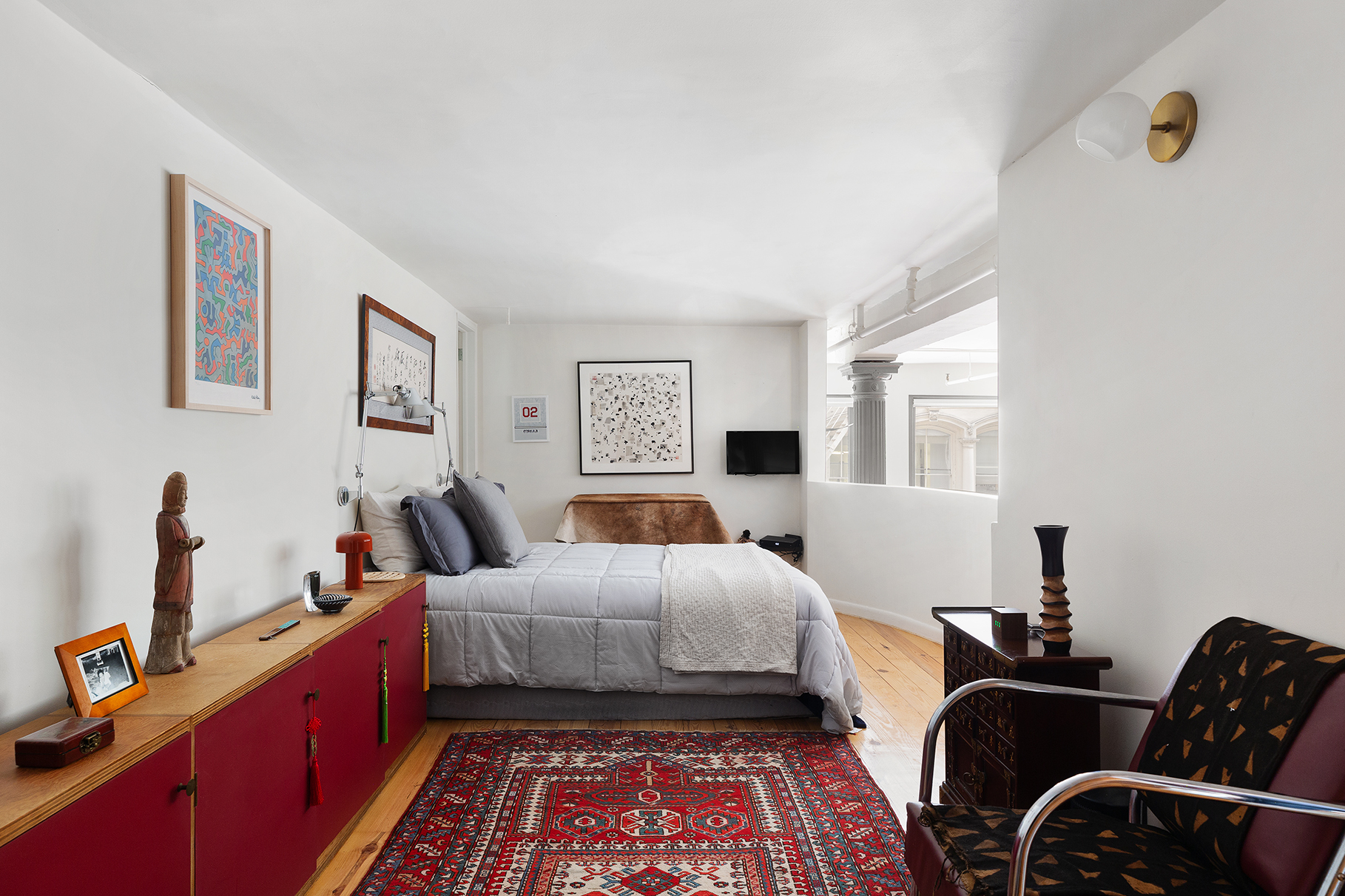 135 Greene Street, Unit 2N Manhattan, NY 10012 - Photo 9 of 13 a bed room with bed and a window