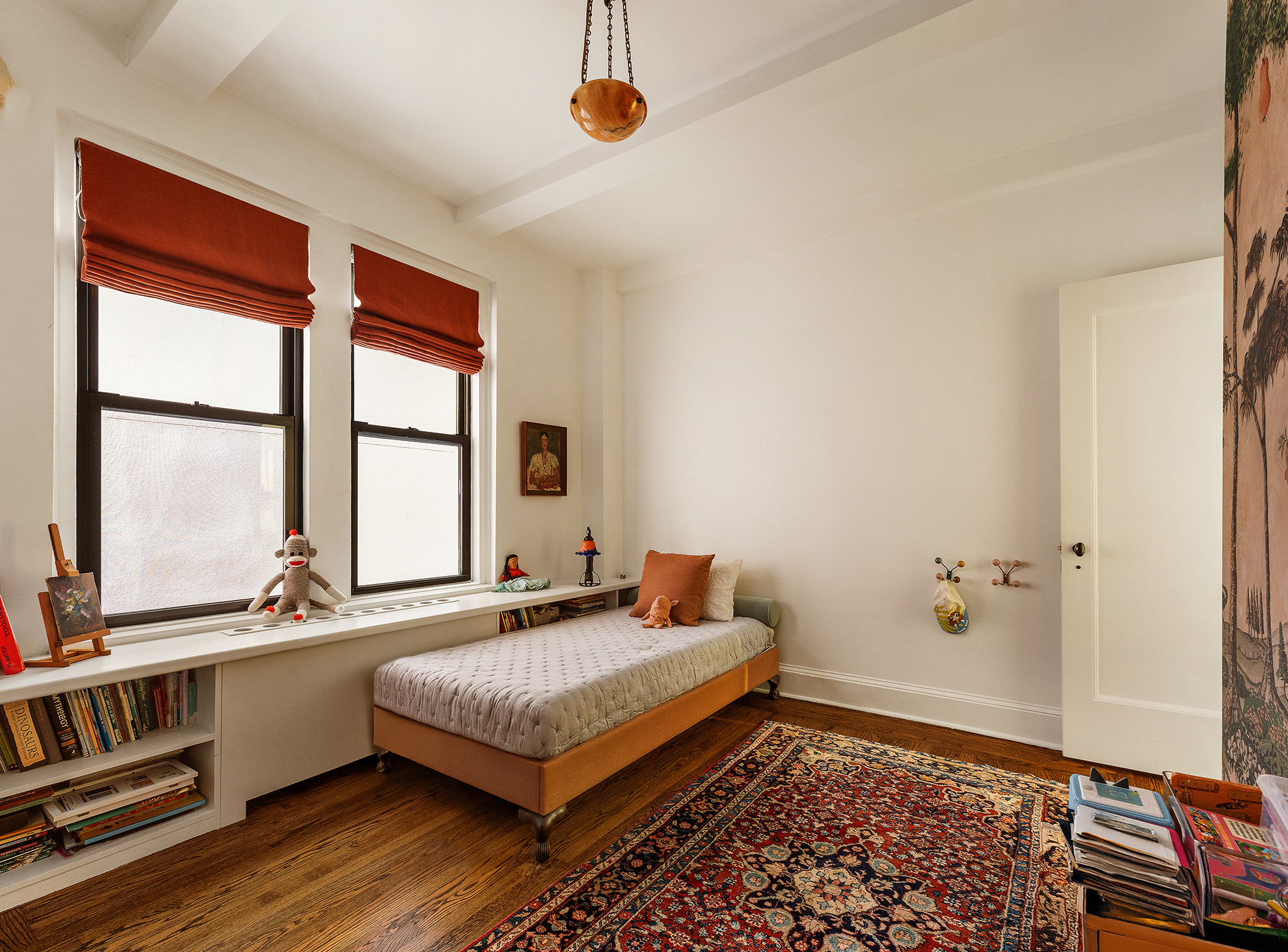 21 East 10th Street, Unit 7D Manhattan, NY 10003 - Photo 9 of 11 a bedroom with a bed and a window