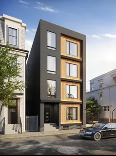 a front view of a building with street view