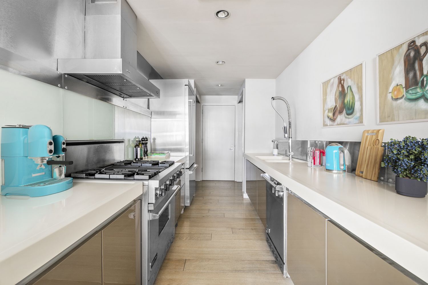 66 9th Avenue, Unit 4W Manhattan, NY 10011 - Photo 6 of 16 a kitchen with a stove and a sink
