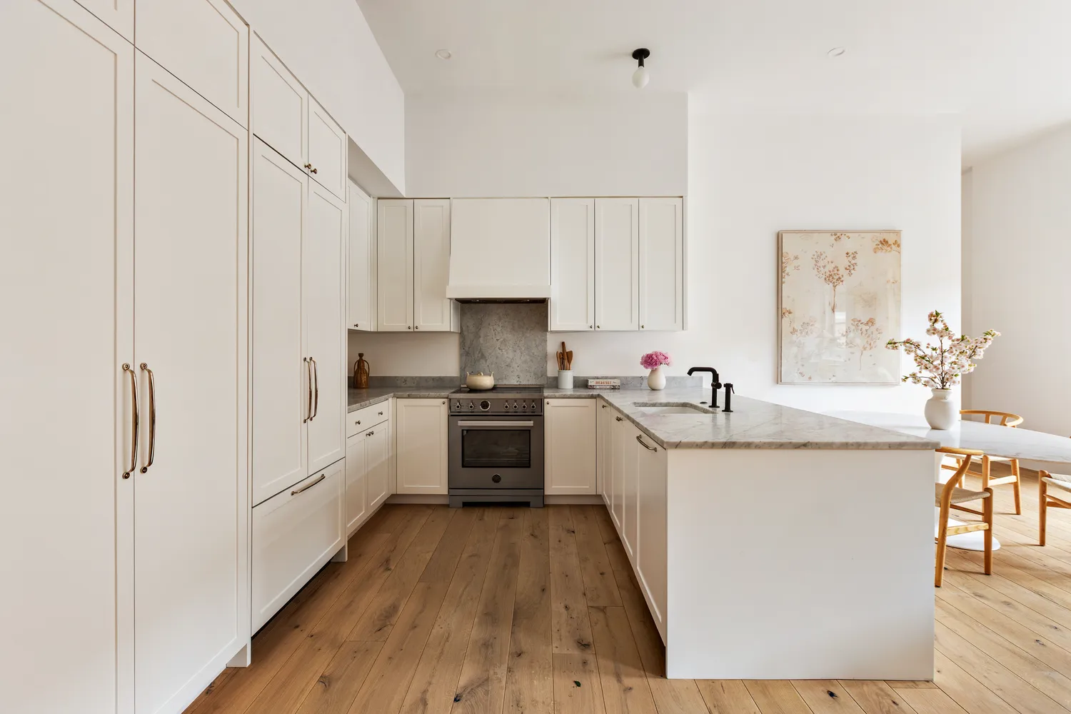 a kitchen with granite countertop a sink stove and refrigerator
