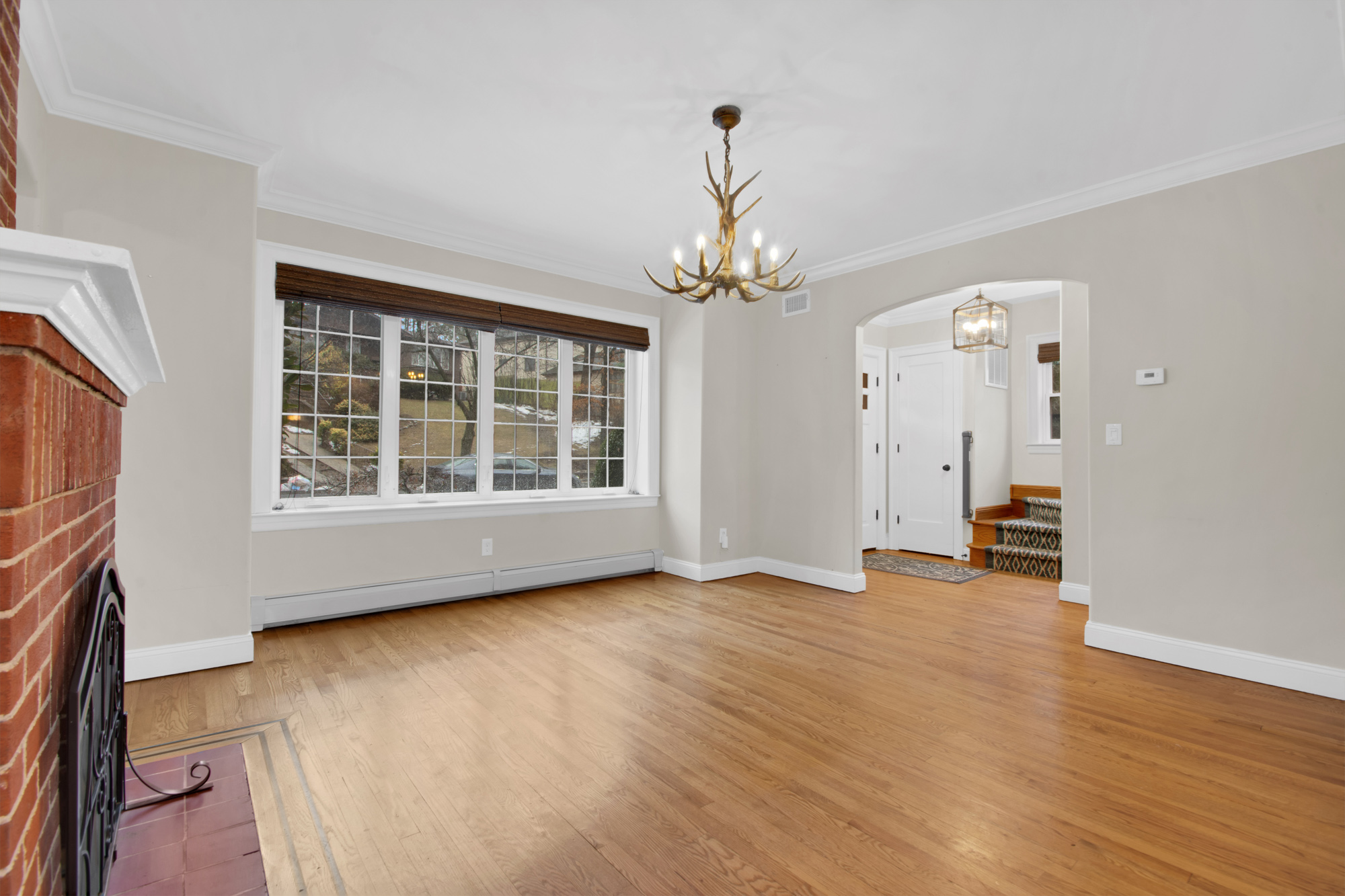 11 Nixon Avenue Staten Island, NY 10304 - Photo 8 of 29 a view of an empty room with wooden floor and a window