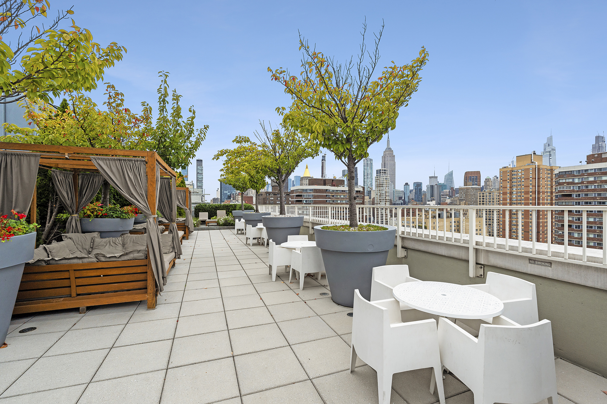 340 East 23rd Street, Unit 15G Manhattan, NY 10010 - Photo 6 of 9 a view of a patio with couches and a table and chairs