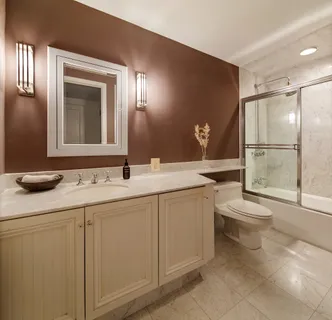 a bathroom with a sink vanity and mirror