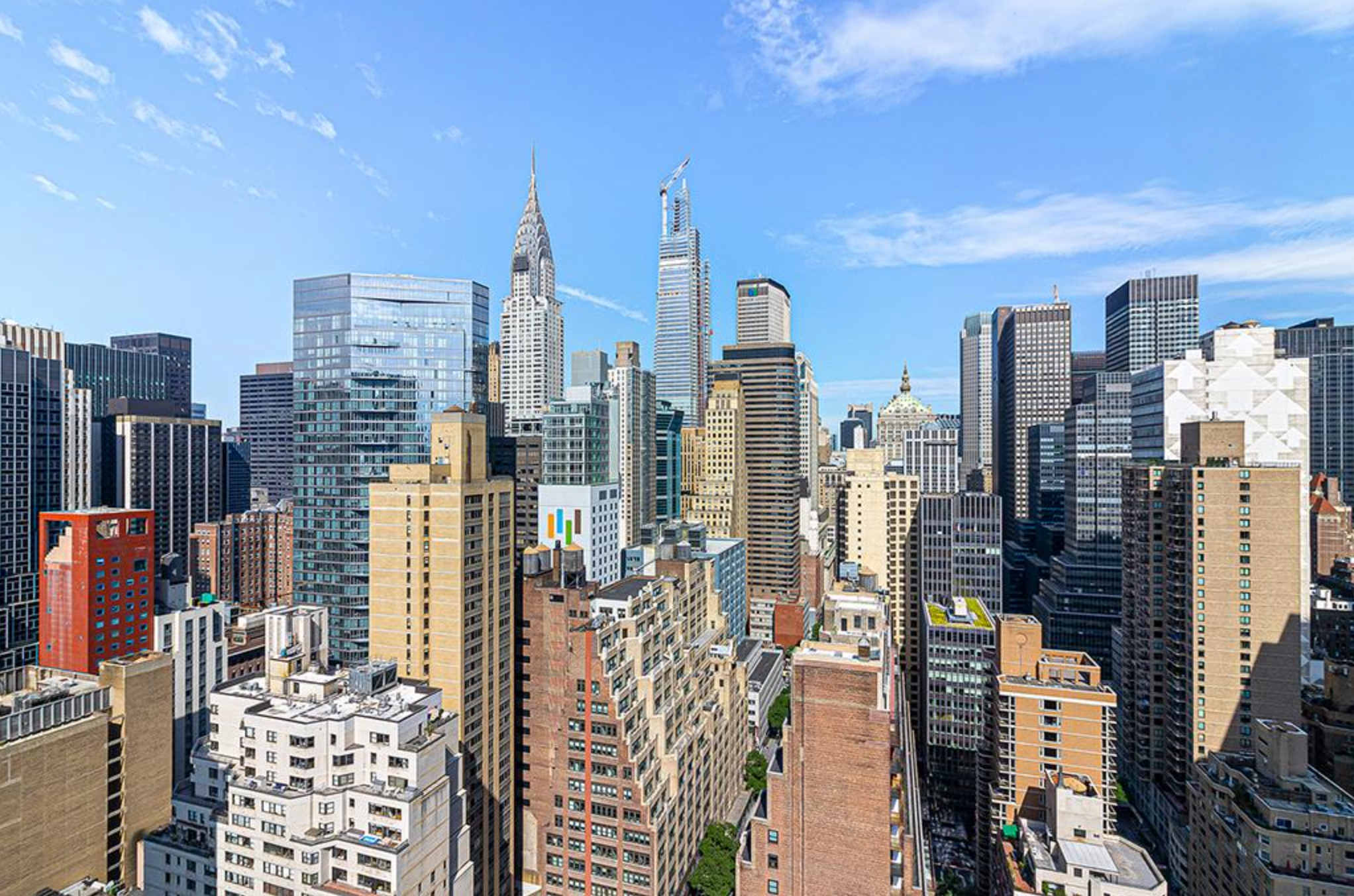 310 East 46th Street, Unit 19F Manhattan, NY 10017 - Photo 9 of 17 a city view with tall buildings