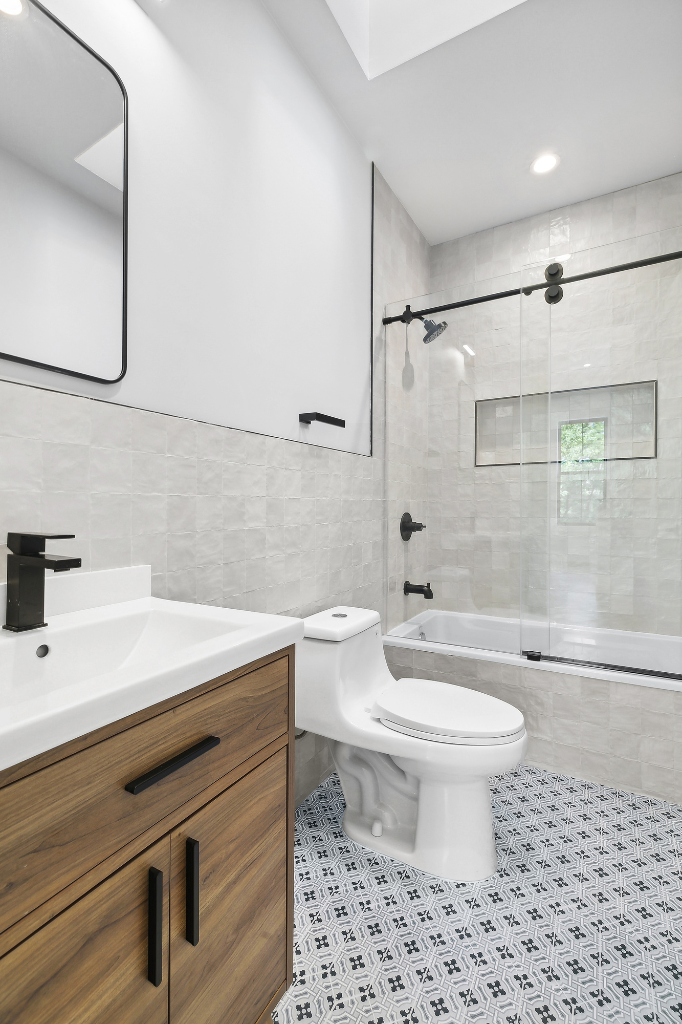 866 Bushwick Avenue, Unit 2 Brooklyn, NY 11221 - Photo 9 of 12 a bathroom with a sink a toilet and shower