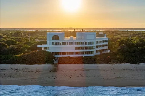 a view of buildings with ocean view