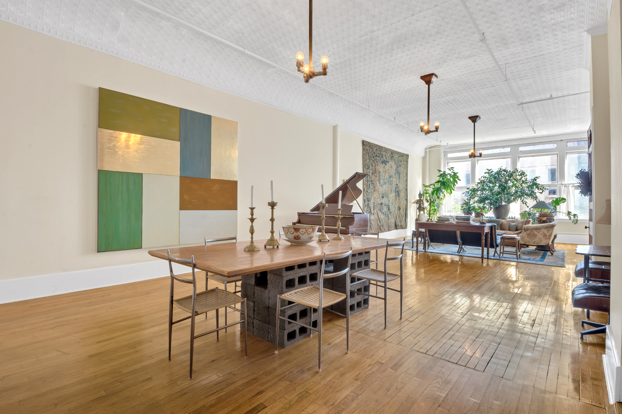 69 Wooster Street, Unit 3 Manhattan, NY 10012 - Photo 6 of 22 a view of a dining room with furniture window and wooden floor