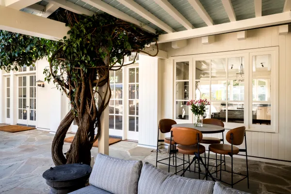 a view of a wooden door and bench