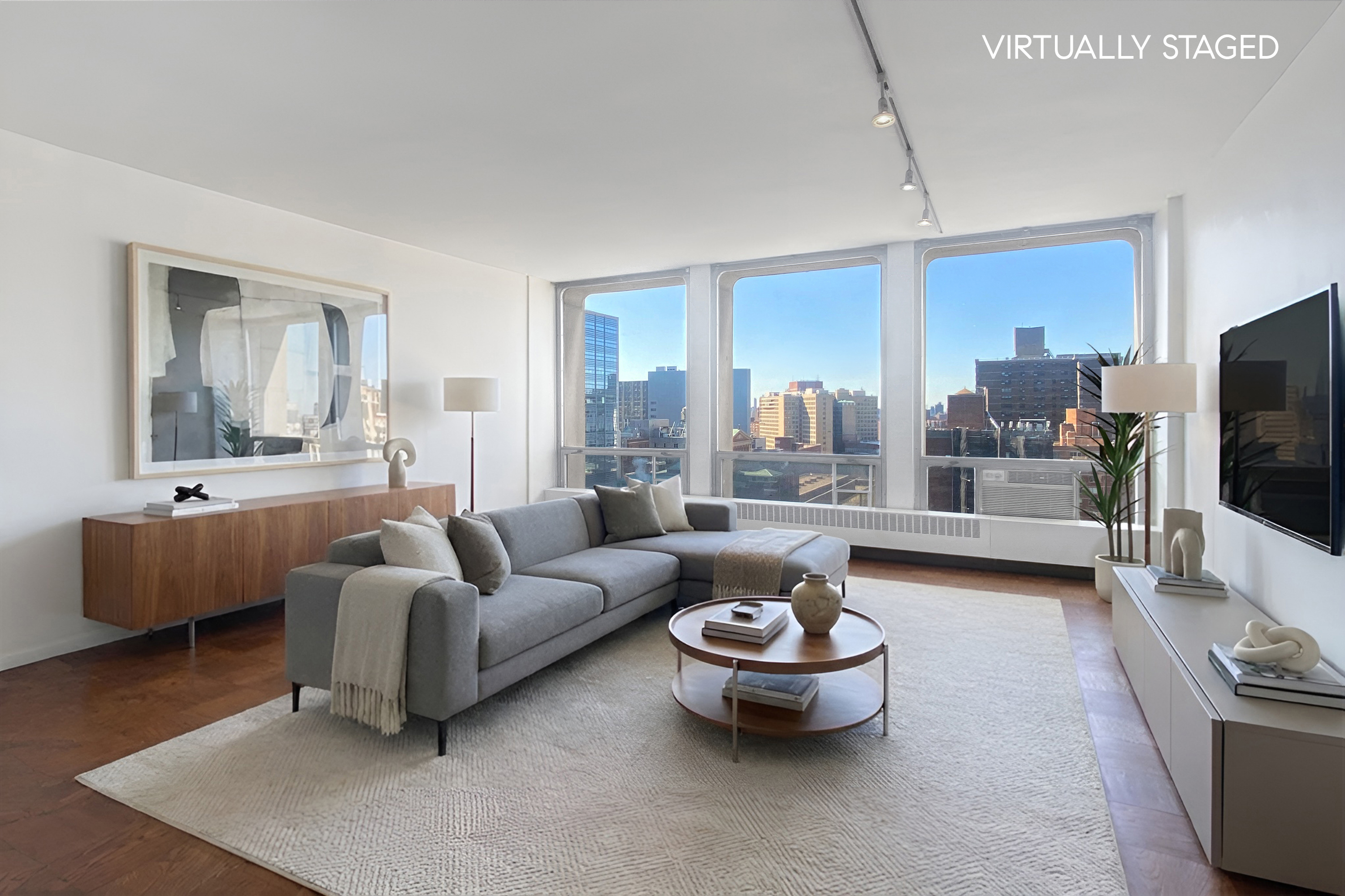 343 East 30th Street, Unit 19K Manhattan, NY 10016 - Photo 1 of 22 a living room with furniture and a flat screen tv