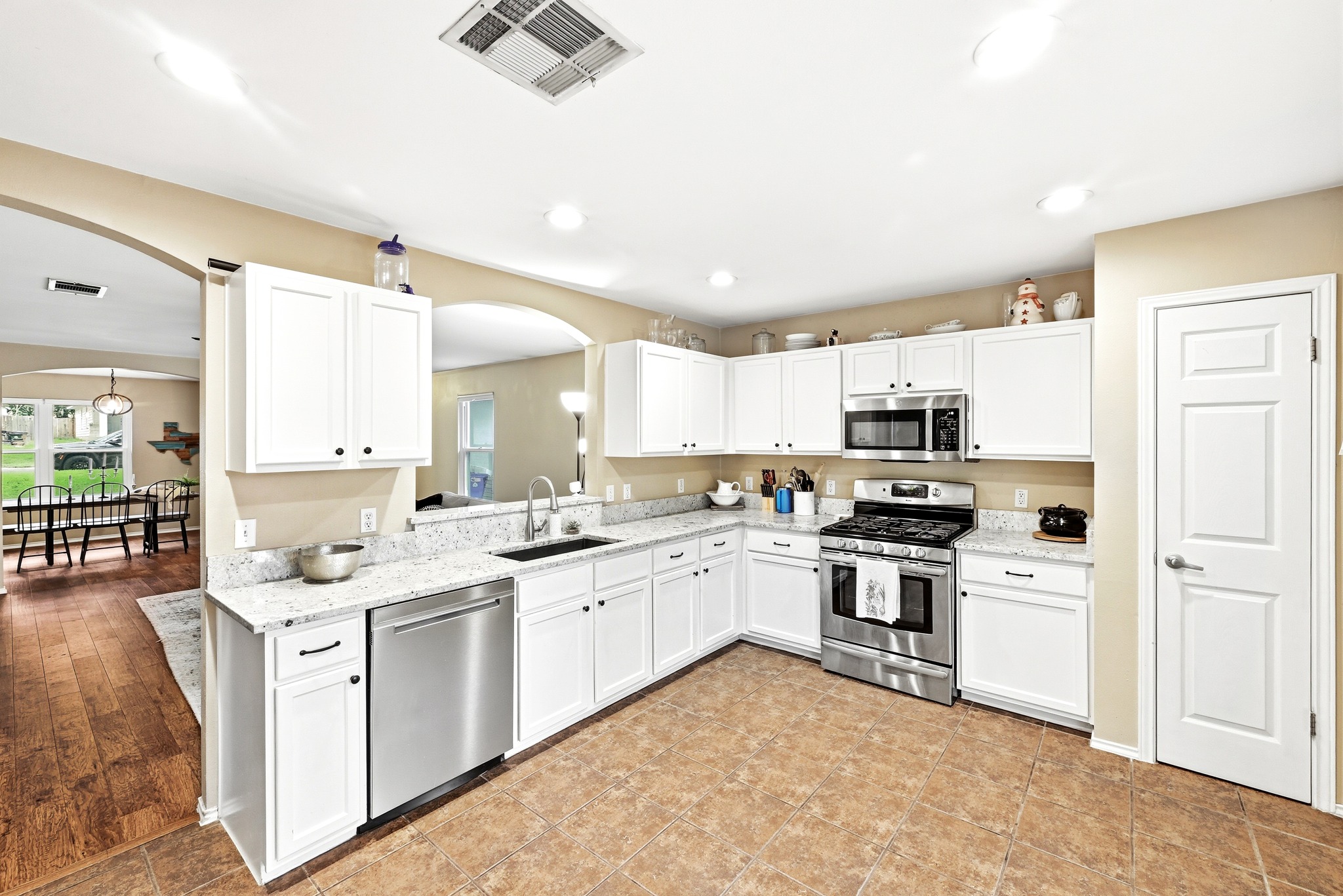 8901 Frock Court Austin, TX 78748 - Photo 14 of 28 a kitchen with stainless steel appliances kitchen island granite countertop a sink and cabinets