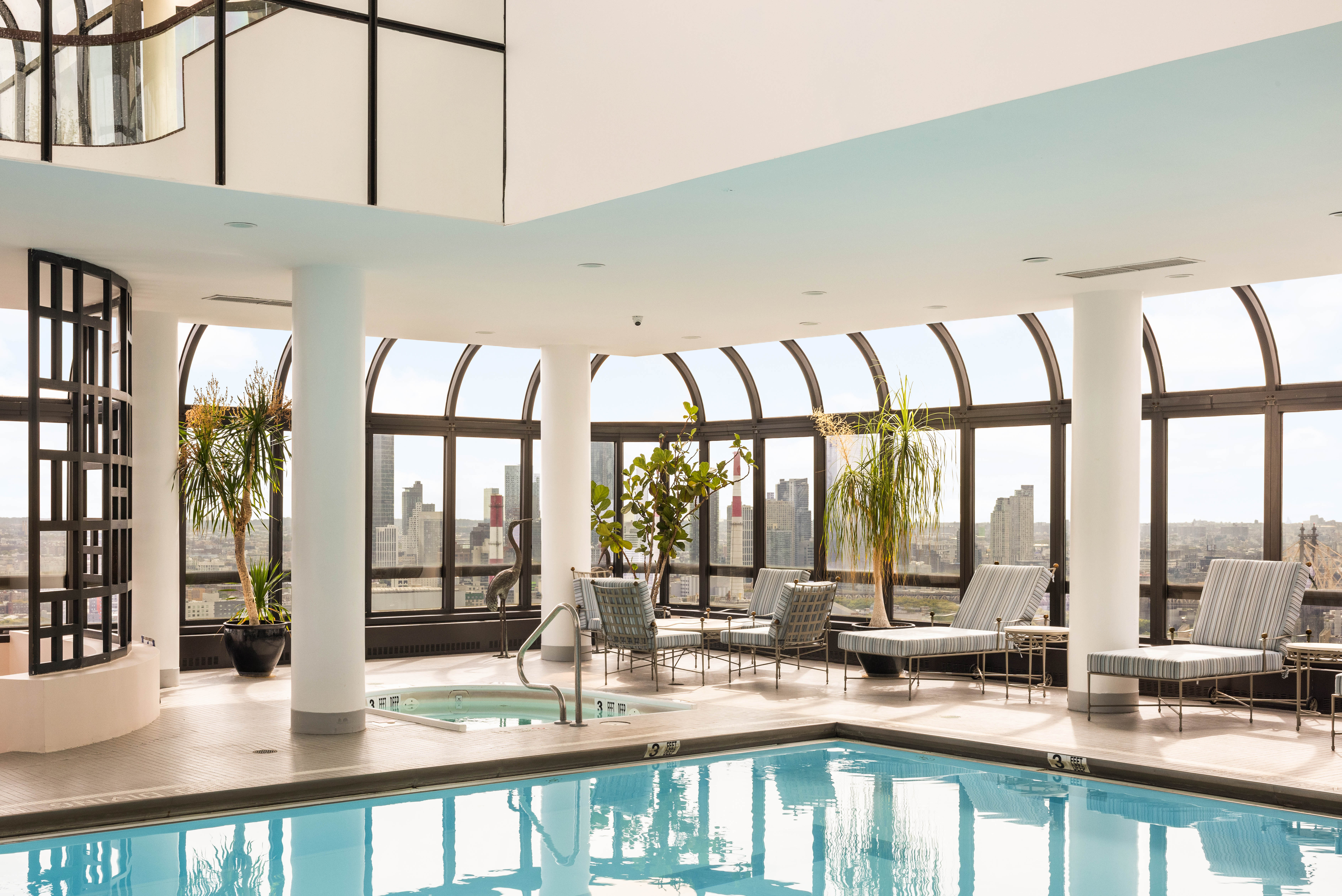 530 East 76th Street, Unit 8CD Manhattan, NY 10021 - Photo 20 of 21 a dining hall with stainless steel appliances granite countertop a coffee table and chairs next to a large window