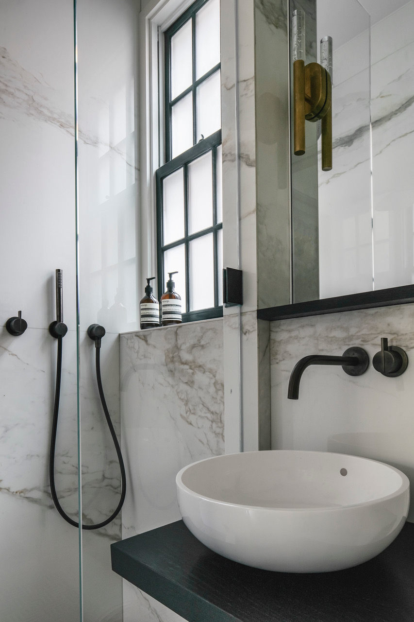 51 Morton Street, Unit 5D Manhattan, NY 10014 - Photo 12 of 17 a bathroom with a sink and mirror