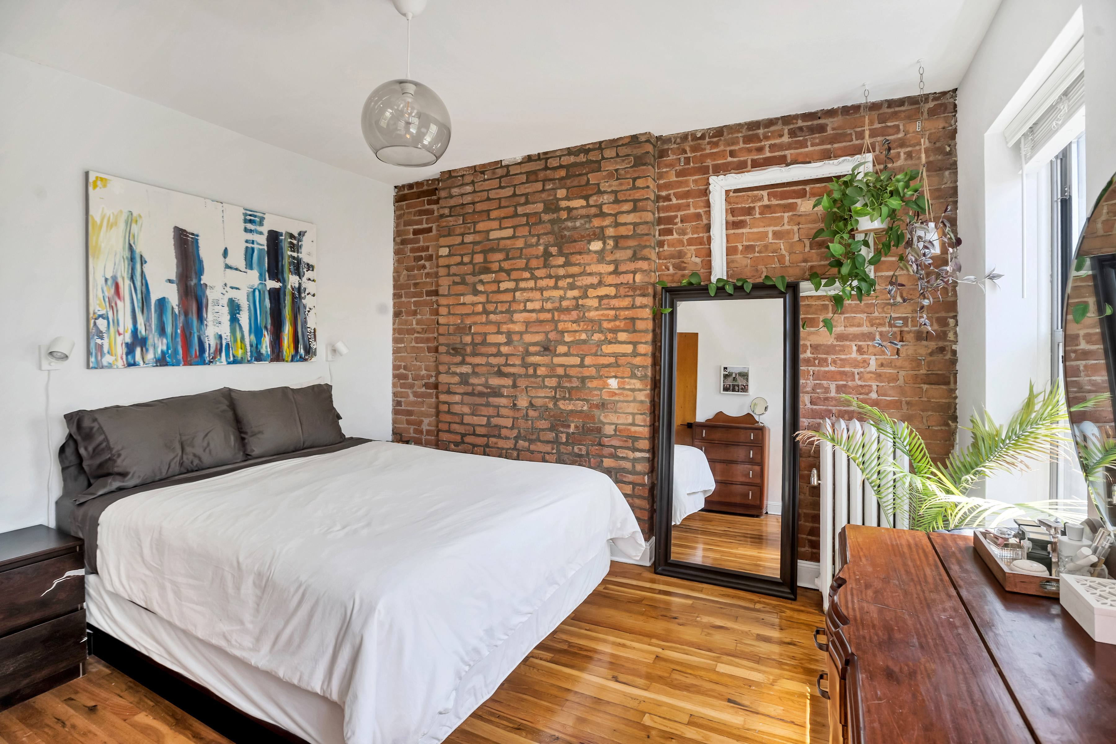 44 Sterling Place, Unit 2 Brooklyn, NY 11217 - Photo 4 of 9 a bedroom with a bed and a large window