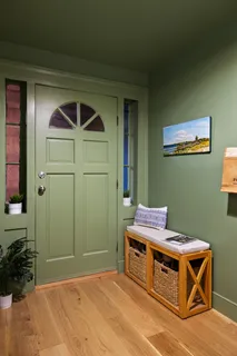 a room with furniture and a potted plant