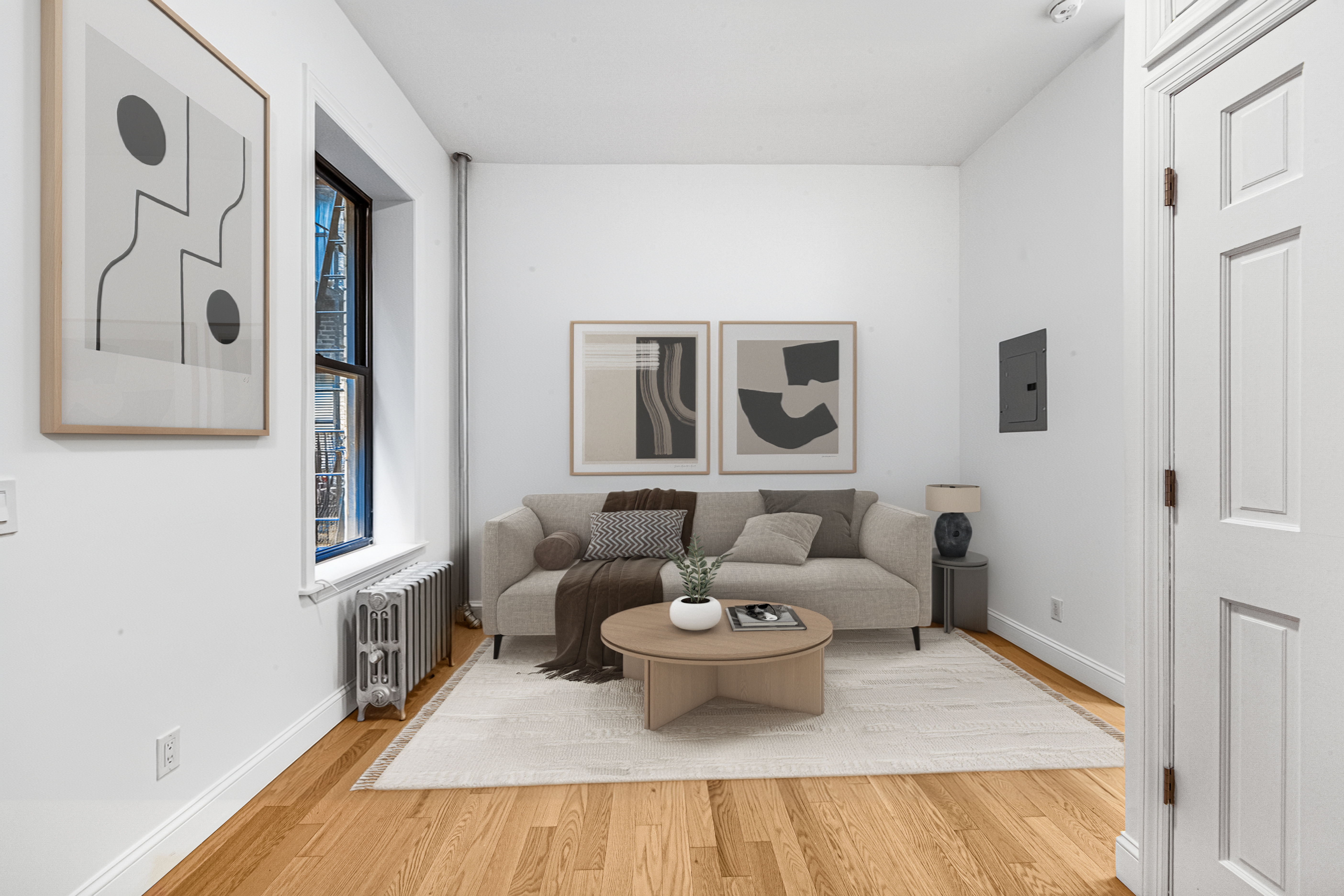 304 East 11th Street, Unit 1C Manhattan, NY 10003 - Photo 4 of 16 a living room with furniture and a wooden floor