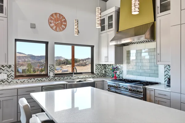 a bathroom with a glass shower door a sink and a bathtub