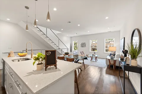 a view of living room with furniture and a flat screen tv