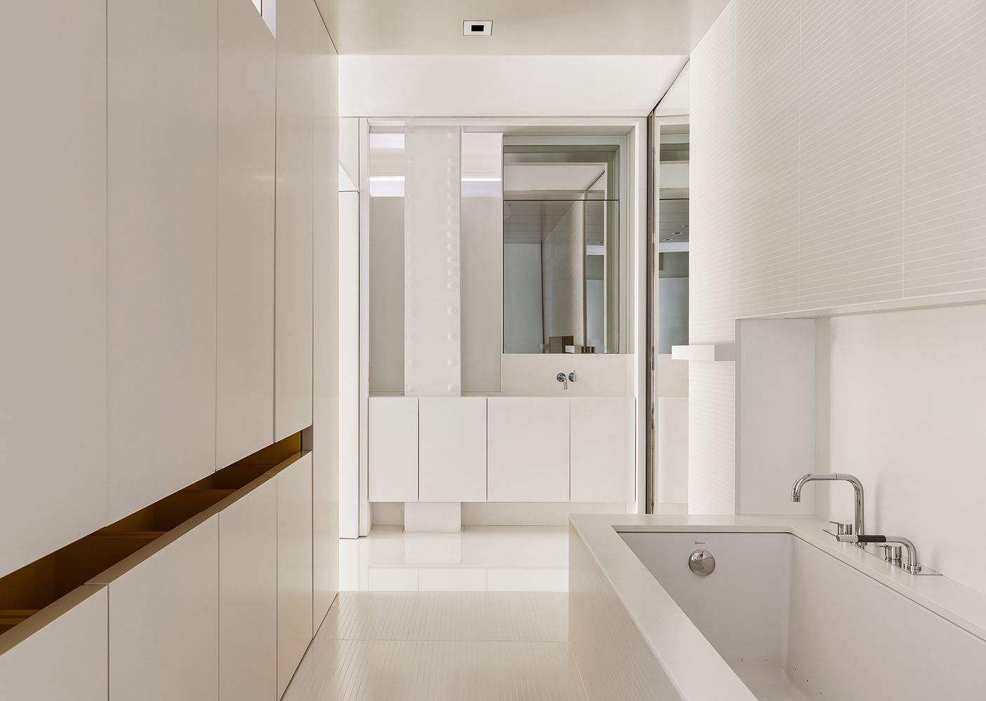 a bathroom with a bathtub and a sink