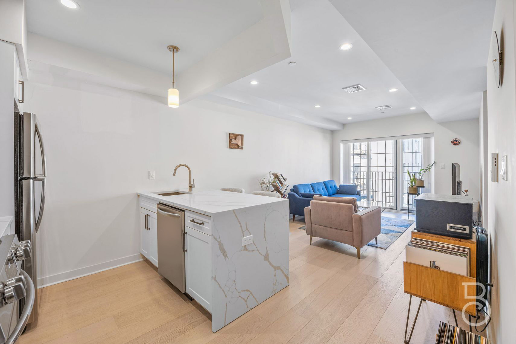 25-74 34th Street, Unit 4C Queens, NY 11103 - Photo 6 of 15 a view of living room with stainless steel appliances furniture and a window