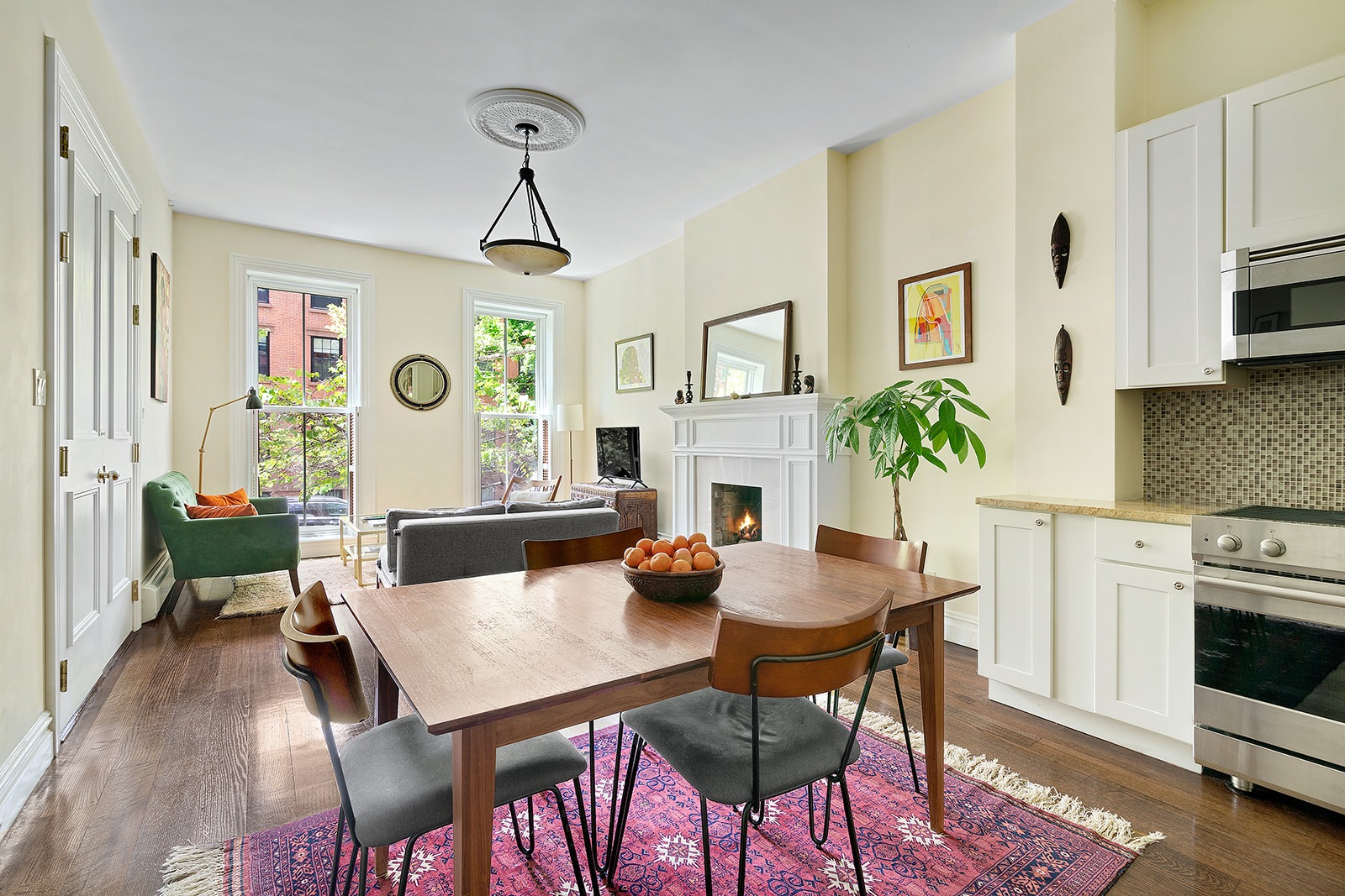 143 Bergen Street, Unit 201 Brooklyn, NY 11217 - Photo 2 of 10 a view of a dining room with furniture and a fireplace