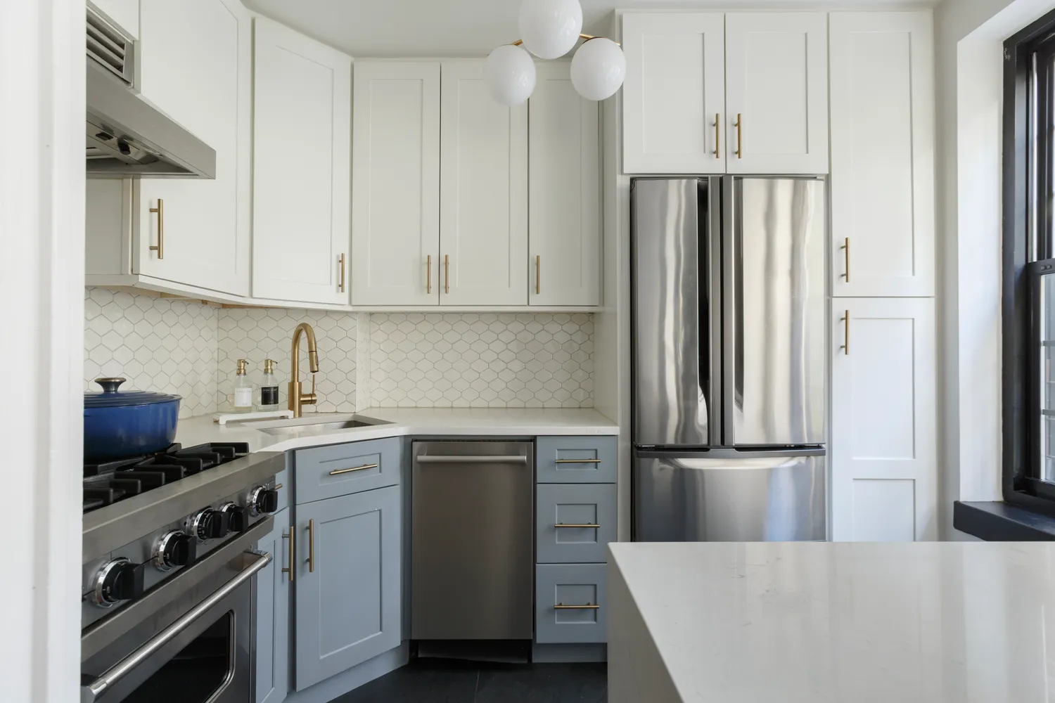 a kitchen with stainless steel appliances a refrigerator sink and cabinets