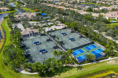 an aerial view of residential house with outdoor space and swimming pool
