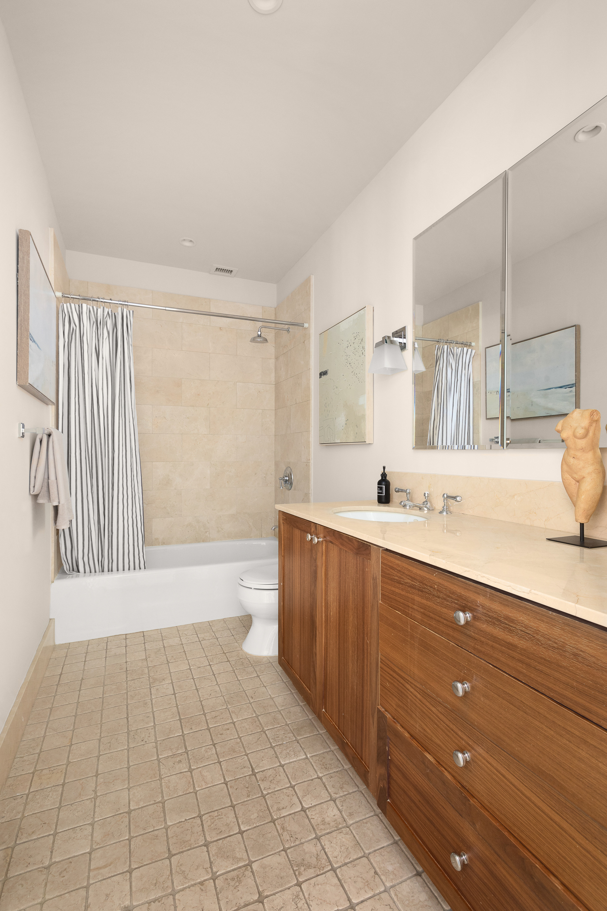 130 West 30th Street, Unit 4C Manhattan, NY 10001 - Photo 12 of 15 a spacious bathroom with a vanity a mirror a bathtub and shower