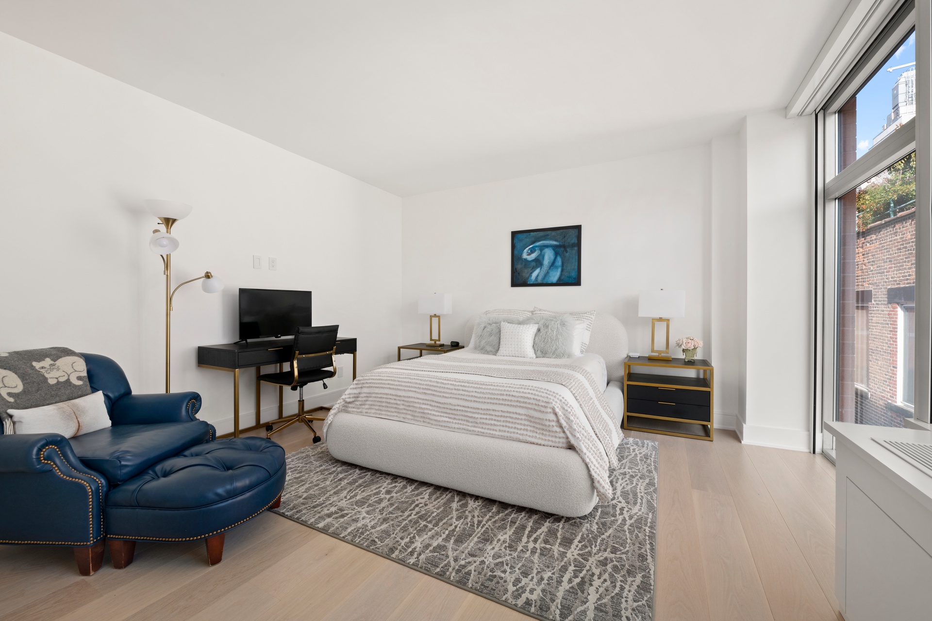 151 West 17th Street, Unit PHF Manhattan, NY 10011 - Photo 8 of 19 a living room with furniture a flat screen tv and a window